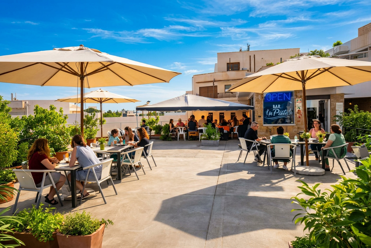 Terraza de día en LA PISTA con sombrillas y plantas